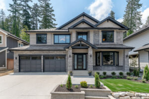 Freshly installed concrete driveway by Fortis Paving in front of a modern home in the Chicago suburbs.